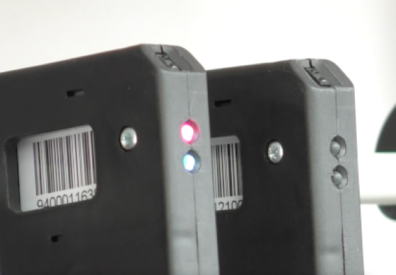 Close-up of HangRx bag handle showing the light-up color system for prescription retrieval
