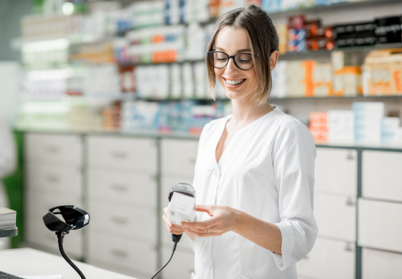 Pharmacist scanning medication,  efficient service with minimal wait times at the pharmacy counter